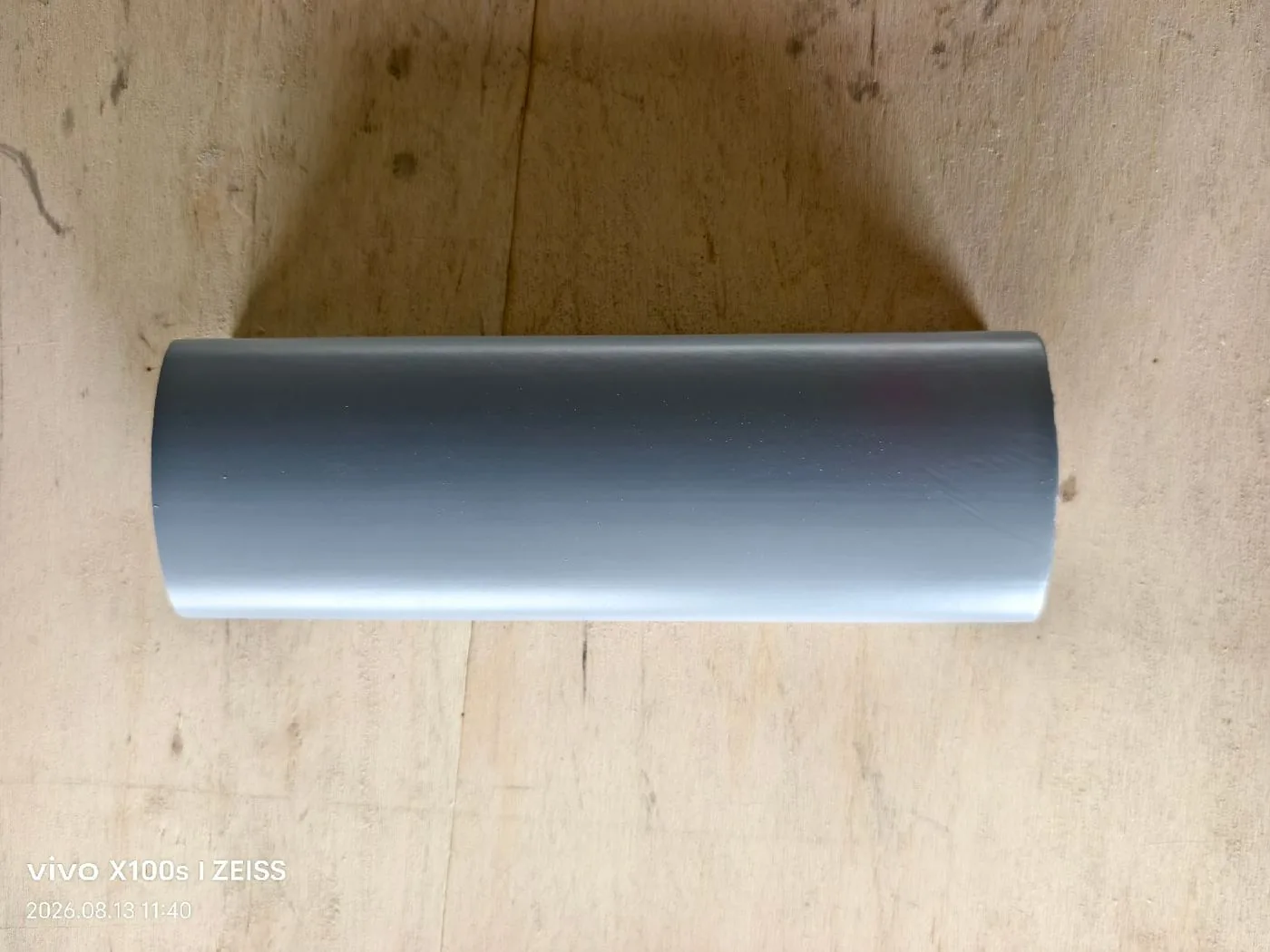 Solid wood handrail profile sample on workshop table